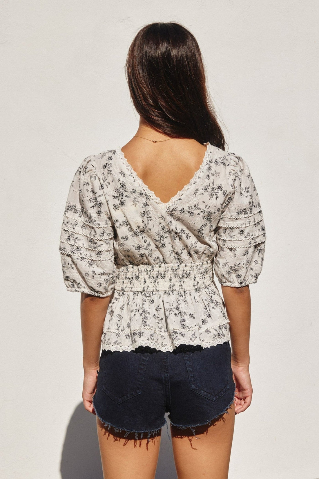 MELINDA SMOCKED PEPLUM TOP